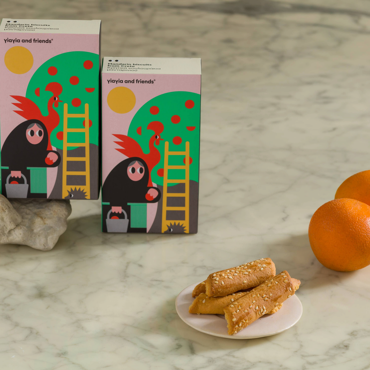 Forager Provisions LTD mandarin biscuits from Crete served on a small plate with fresh oranges on a marble surface.