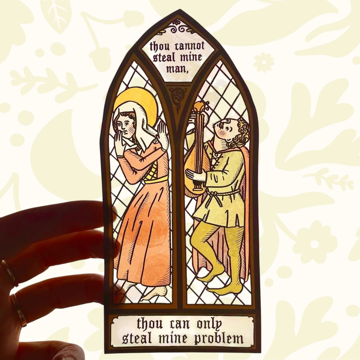 Forager Provisions LTD Clarice Tudor medieval stained glass window sticker with humorous text held against the sky.