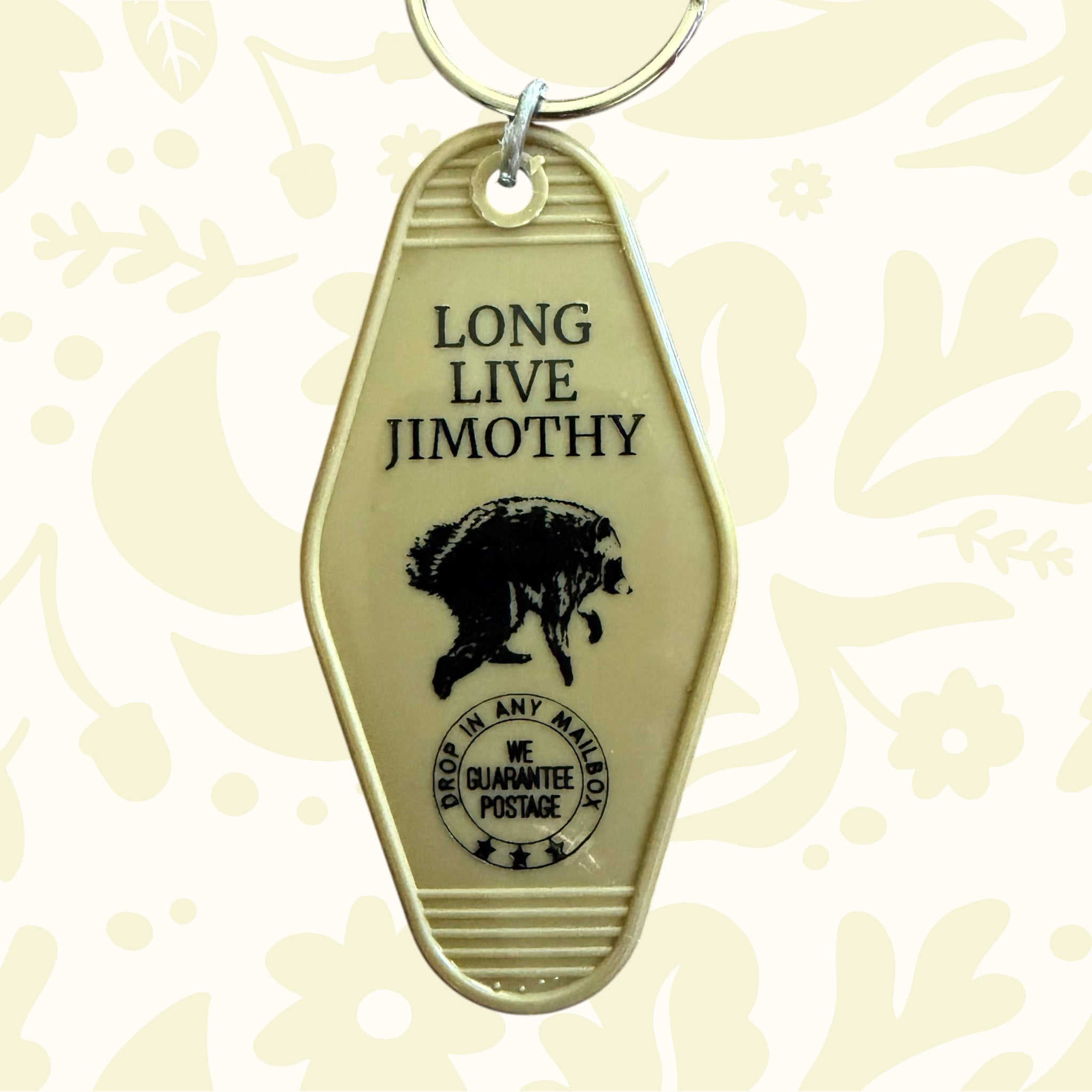 Forager Provisions LTD vintage-style plastic motel key fob in beige with Long Live Jimothy text and bear graphic.