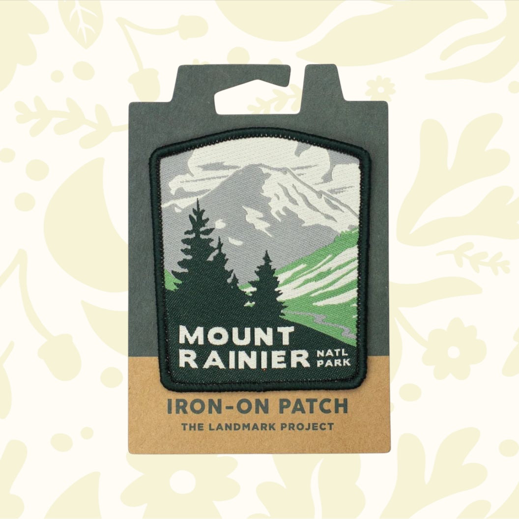 Forager Provisions LTD Mount Rainier National Park iron-on patch featuring a mountain and forest graphic design.