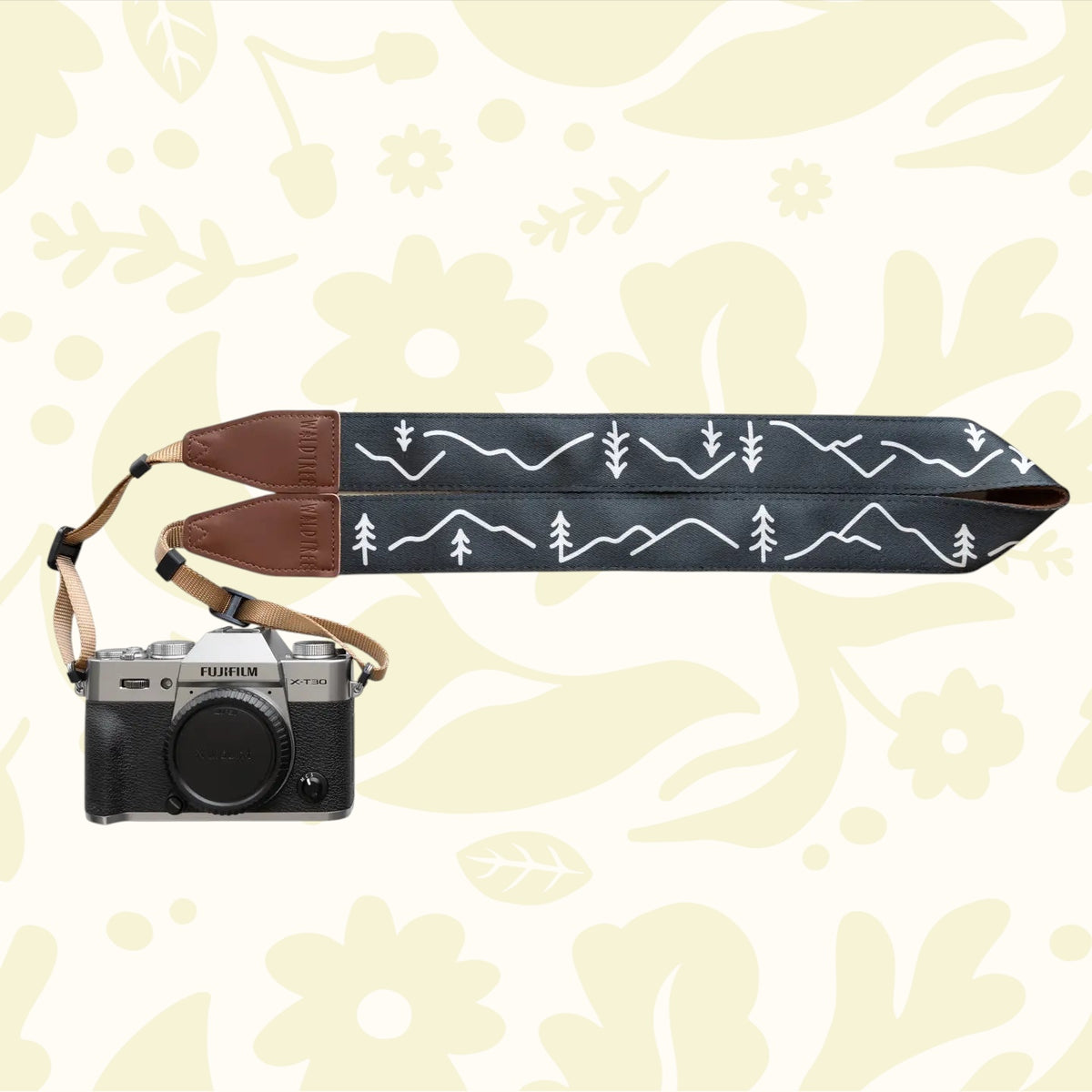 Forager Provisions LTD Wildtree camera strap with minimal white mountain line art on black fabric and brown leather