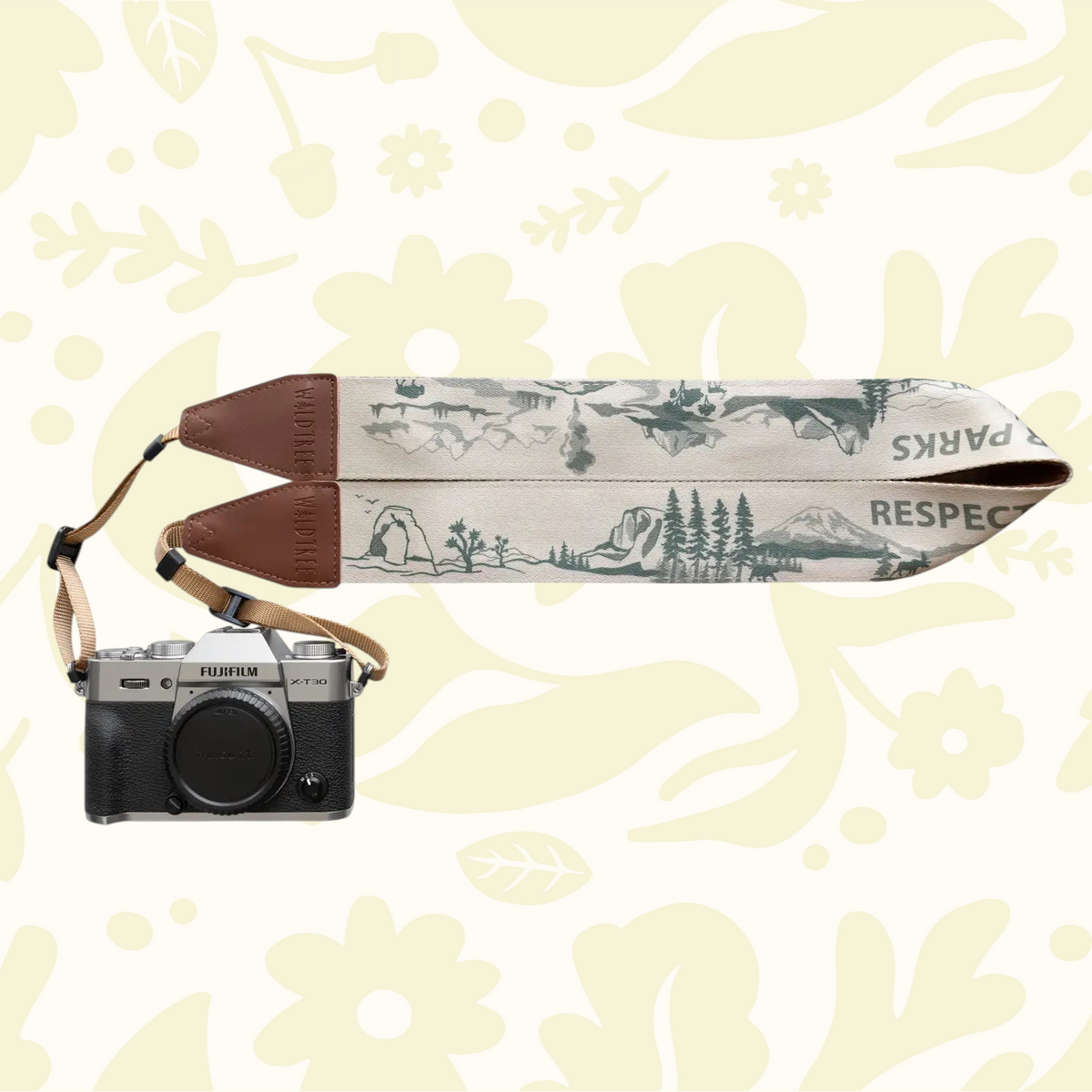 Forager Provisions LTD Wildtree National Parks camera strap with scenic landscape print and brown faux leather accents.