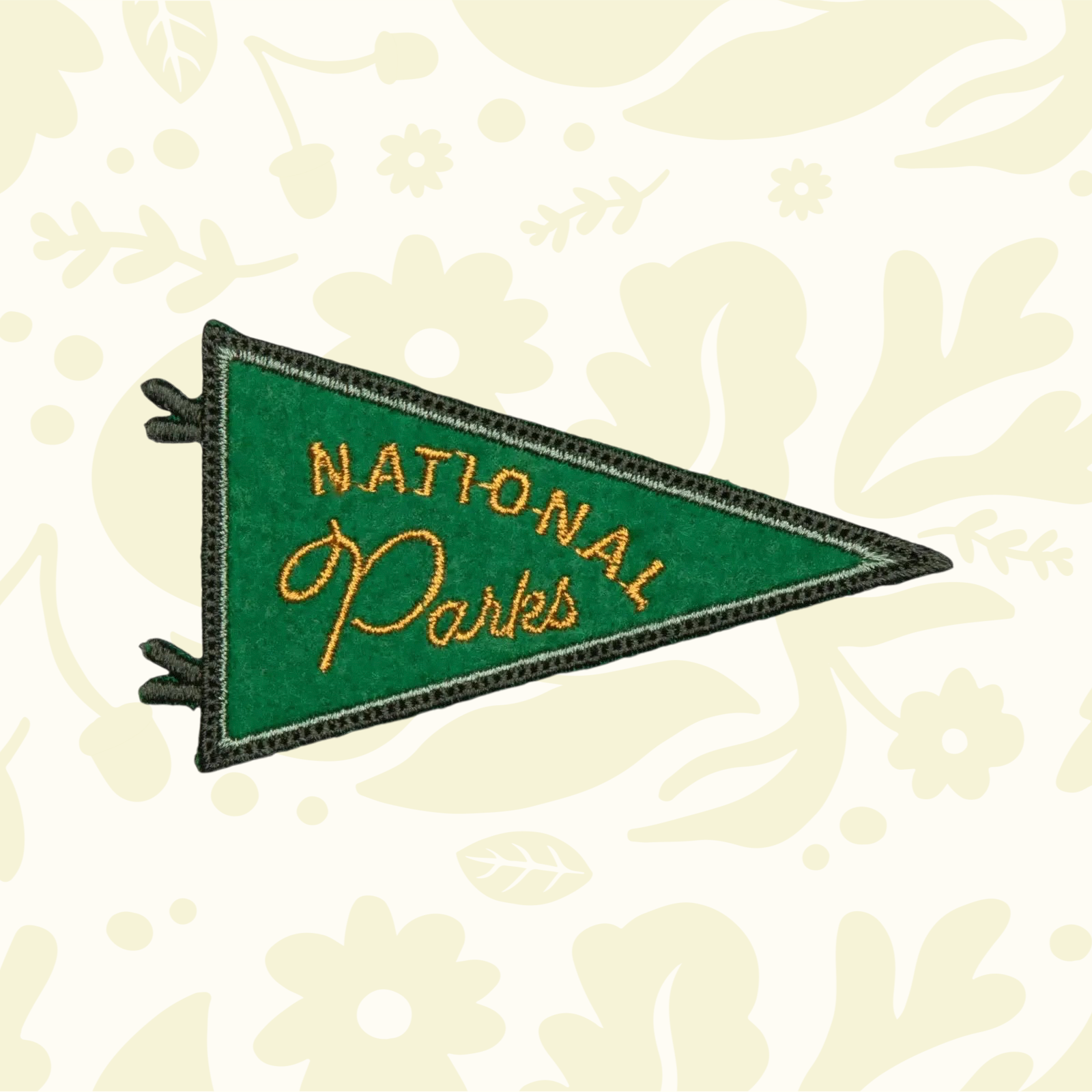 Forager Provisions LTD National Parks pennant patch in green felt with gold embroidered text and iron-on backing.