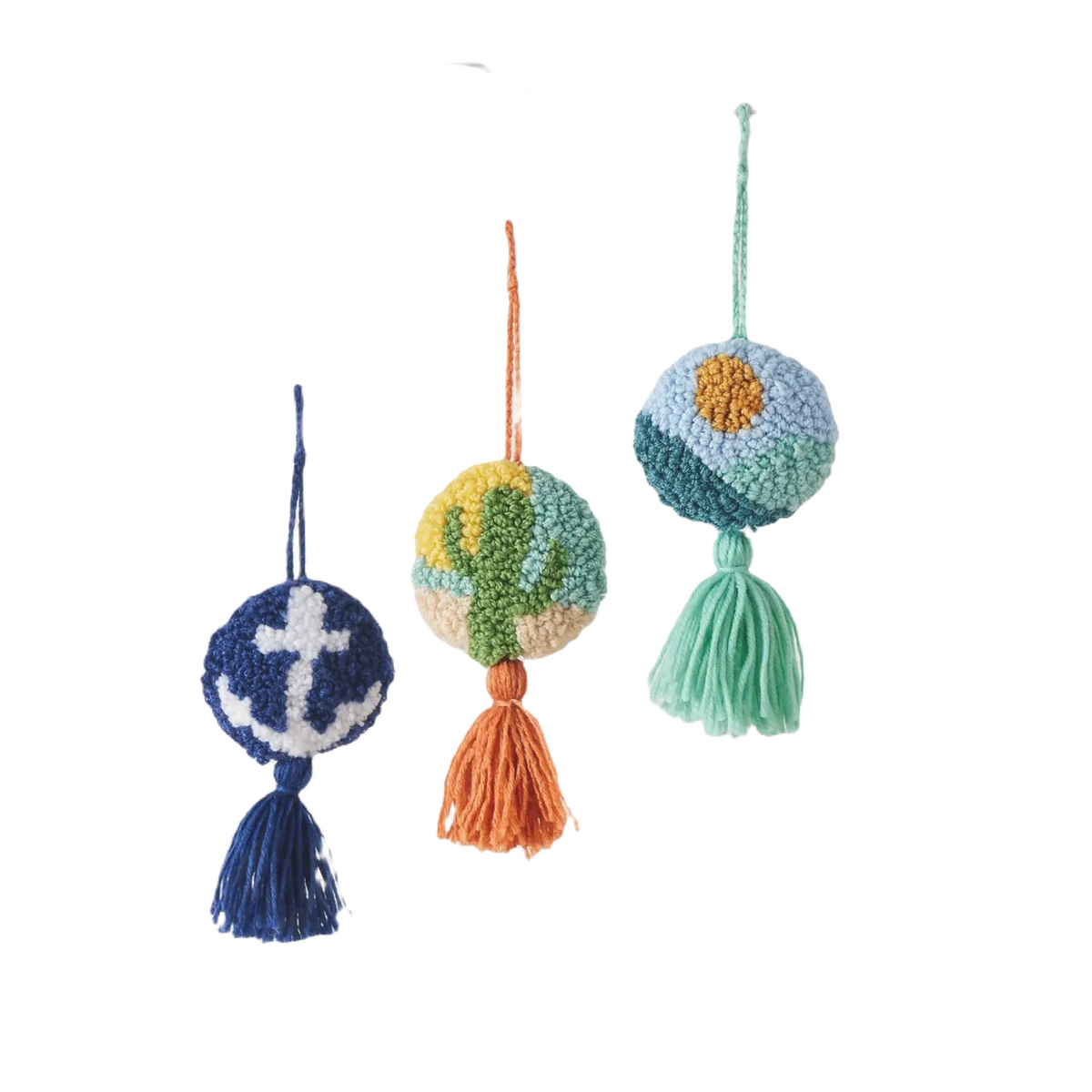 Forager Provisions LTD set of three round nautical hanging ornaments with anchor, cactus, and sun designs and tassels.