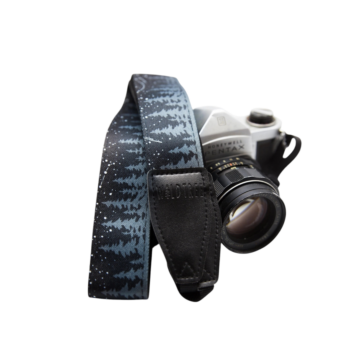 Forager Provisions LTD Wildtree camera strap with a night sky forest print and black faux suede accents on a vintage camera