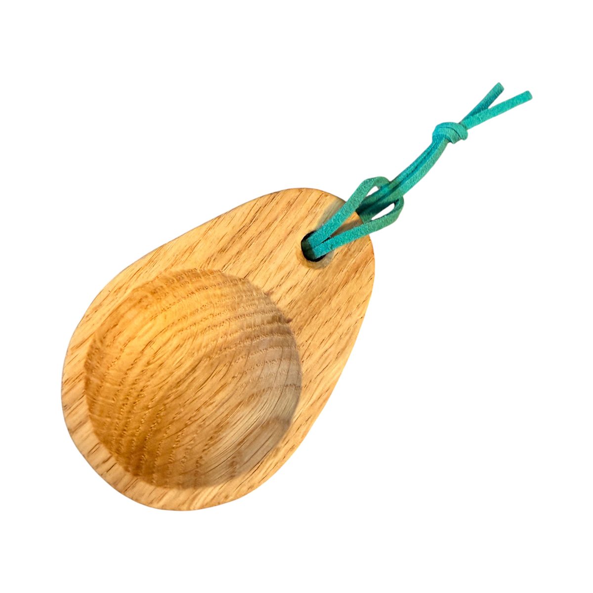 Forager Provisions LTD oak wood camping scoop with a green tie for attaching to a rucksack, ideal for outdoor coffee.