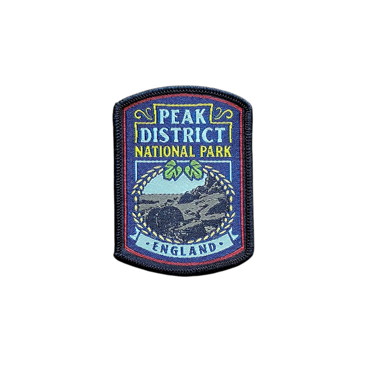 Forager Provisions LTD Peak District National Park embroidered patch with landscape design on a wooden background.