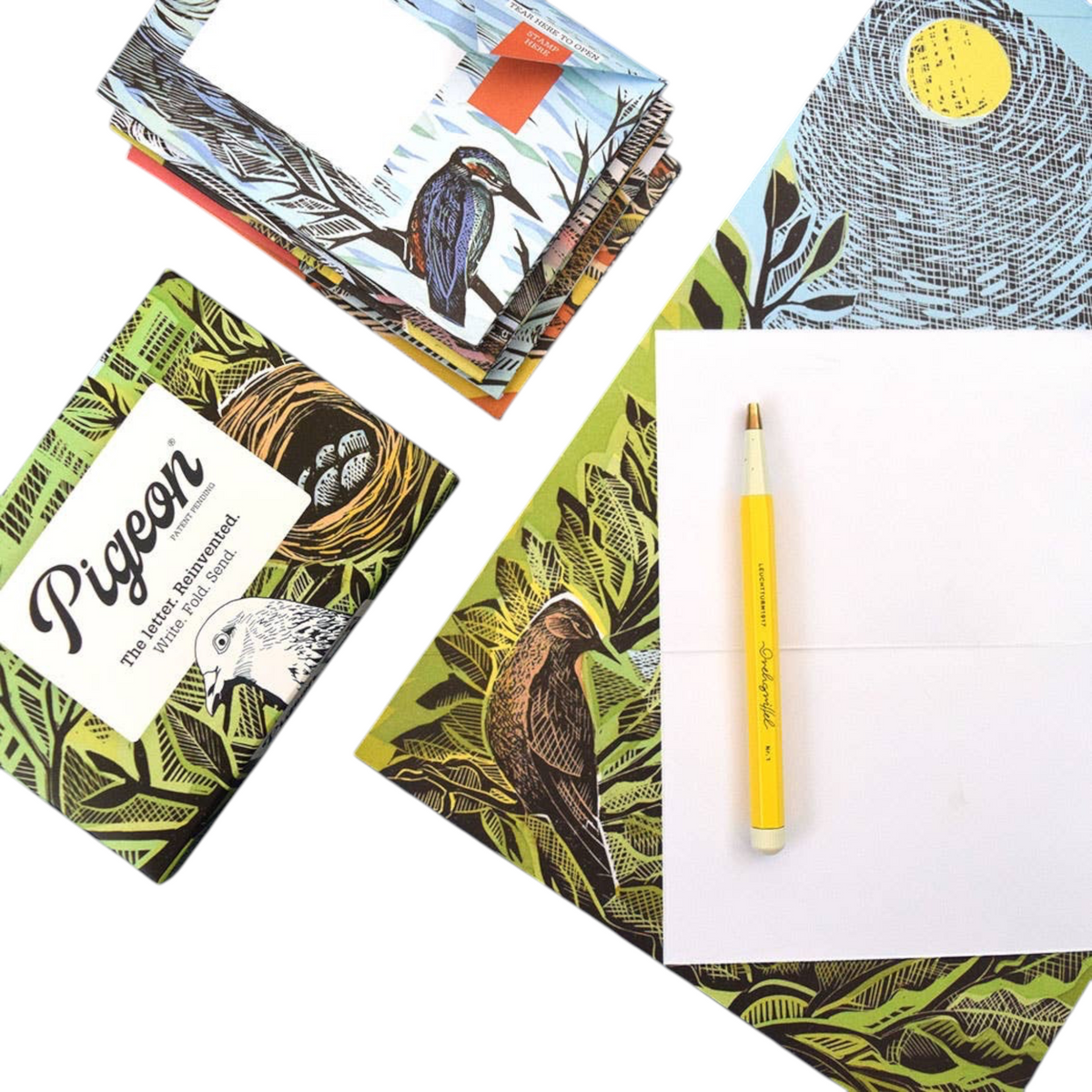 Forager Provisions LTD Pigeonposted folding letter set featuring illustrated bird designs and a yellow pen on white paper