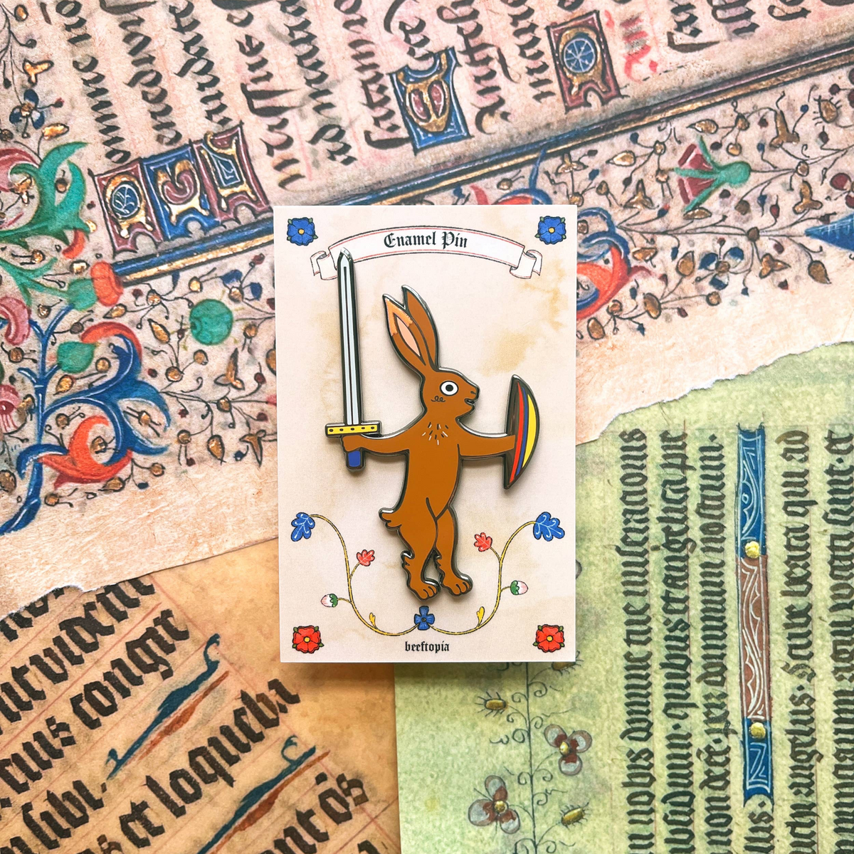 Forager Provisions LTD Beeftopia enamel pin featuring a brown rabbit knight holding a sword and shield on card