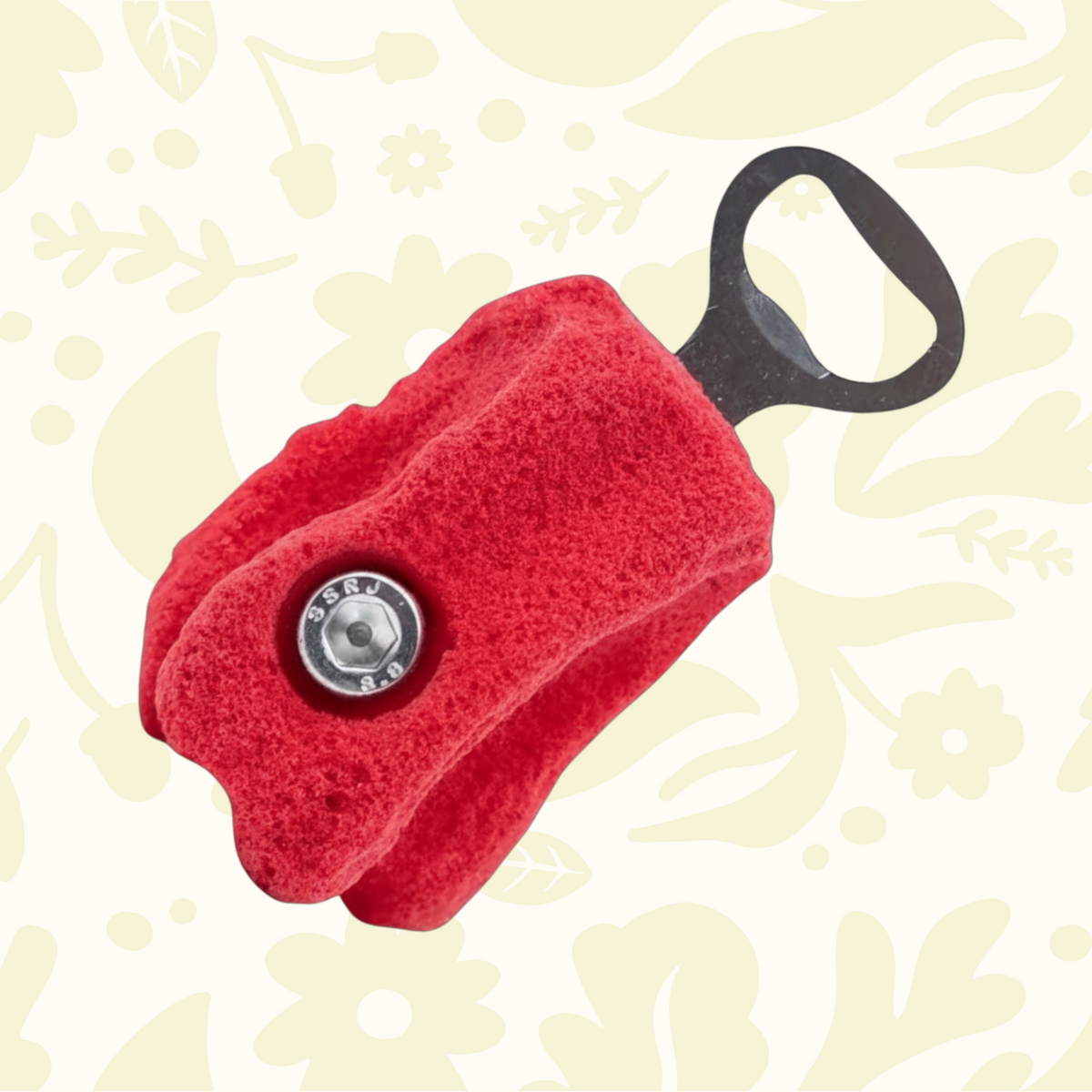 Forager Provisions LTD Seven Peaks red rock climbing hold bottle opener with a textured grip and metal hardware.