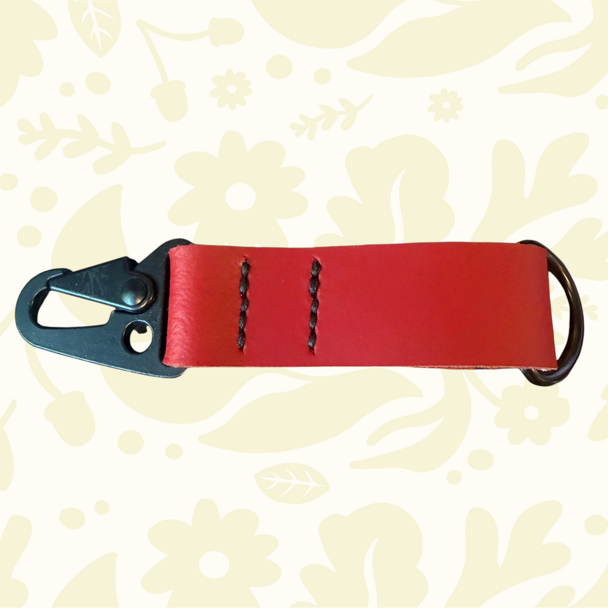 Kjøtt Forager Provisions Leather Key Fob 2026, metal clip & ring, new colors displayed on floral background.