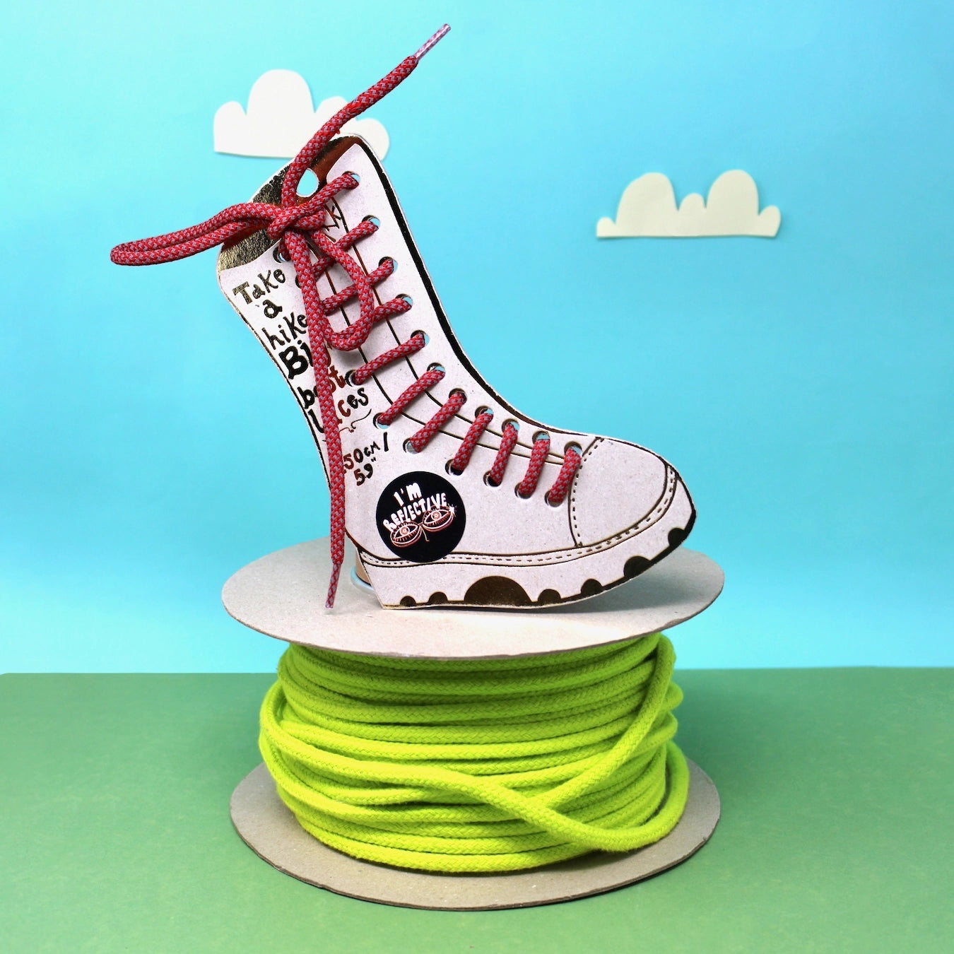 Forager Provisions LTD Ark Colour Design red and silver reflective boot laces displayed on a cardboard boot cutout