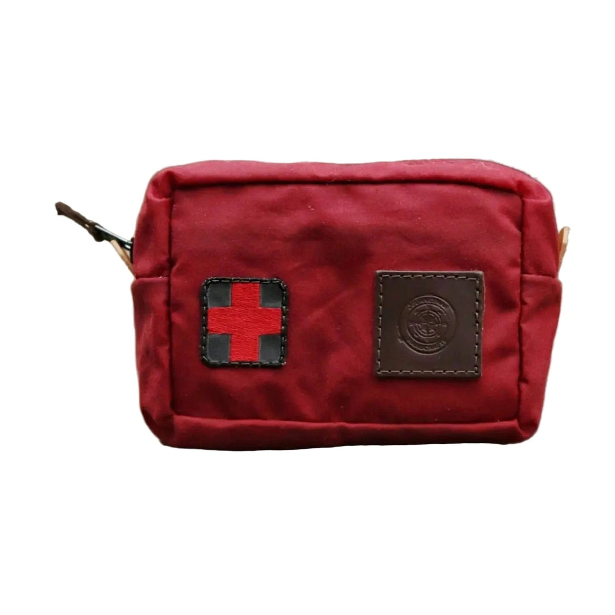 Red waxed canvas first aid kit belt pouch with zipper and red cross; perfect for outdoor emergencies by Journeyman Craft.