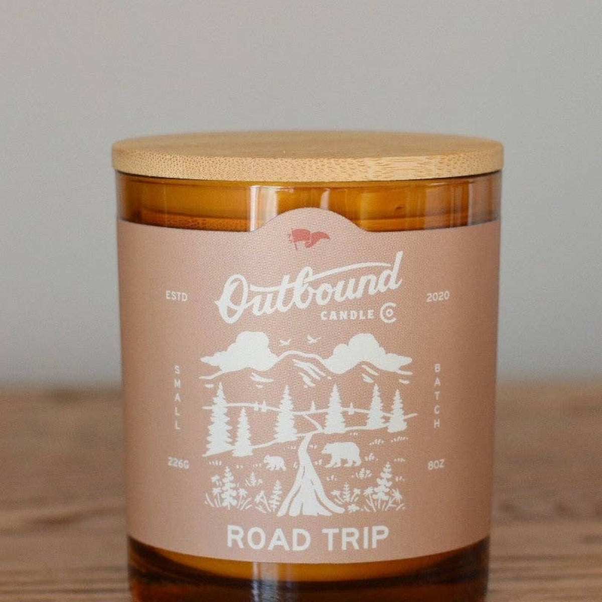 Forager Provisions LTD Road Trip 8oz soy candle in amber glass jar with bamboo lid and mountain forest label design
