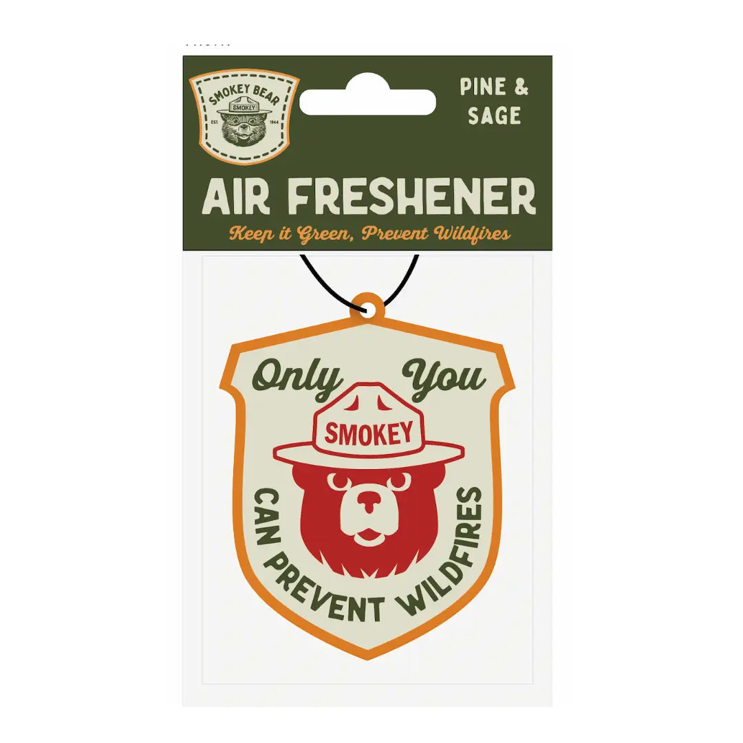 Forager Provisions LTD Smokey Bear hanging vehicle air freshener with pine and sage scent in a shield design.