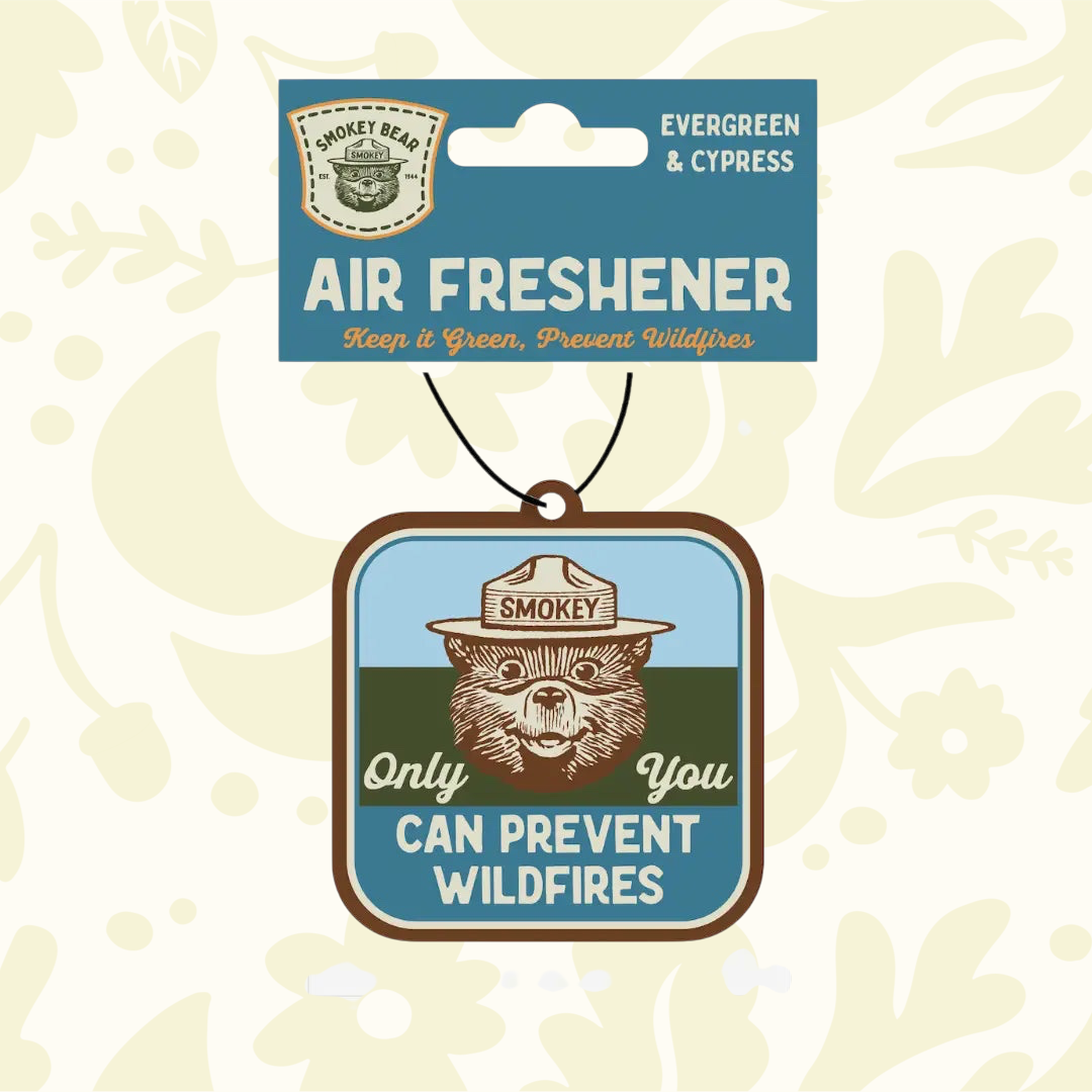 Forager Provisions LTD Smokey Bear hanging air freshener with Evergreen and Cypress scent and forest illustration.