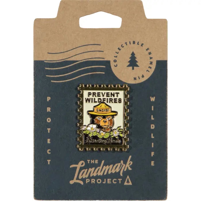 Forager Provisions LTD Smokey Bear enamel pin in a vintage postage stamp design on branded cardboard backing.