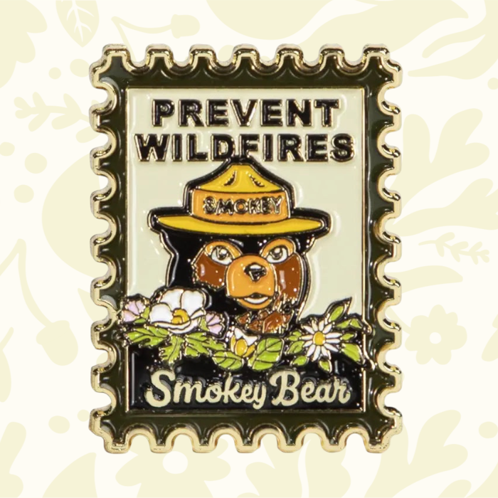 Forager Provisions LTD Smokey Bear enamel pin featuring a vintage stamp design with the text Prevent Wildfires.