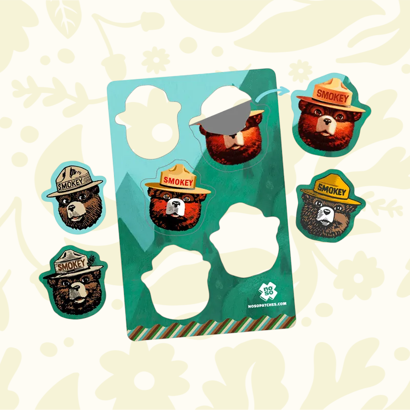 Forager Provisions LTD Smokey Bear Dazzits x NoSo peel-and-stick repair patches on a sheet with individual icons.