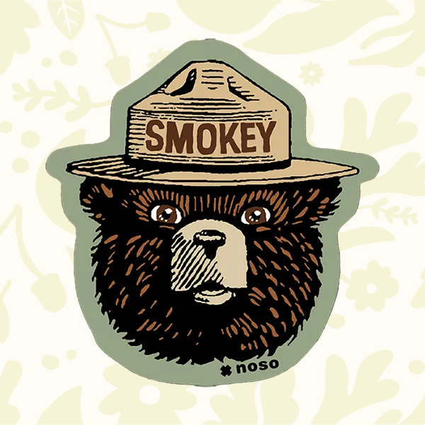 Forager Provisions LTD Smokey Bear retro logo peel-and-stick repair patch for outdoor gear on a patterned background