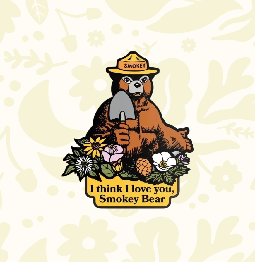 Forager Provisions LTD Smokey Bear vinyl sticker featuring a bear with a shovel and flowers, text I think I love you.