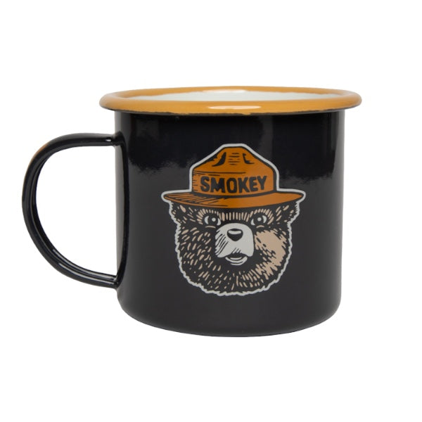 Forager Provisions LTD navy enamel camping mug featuring a Smokey Bear graphic with a tan rim and handle detail.