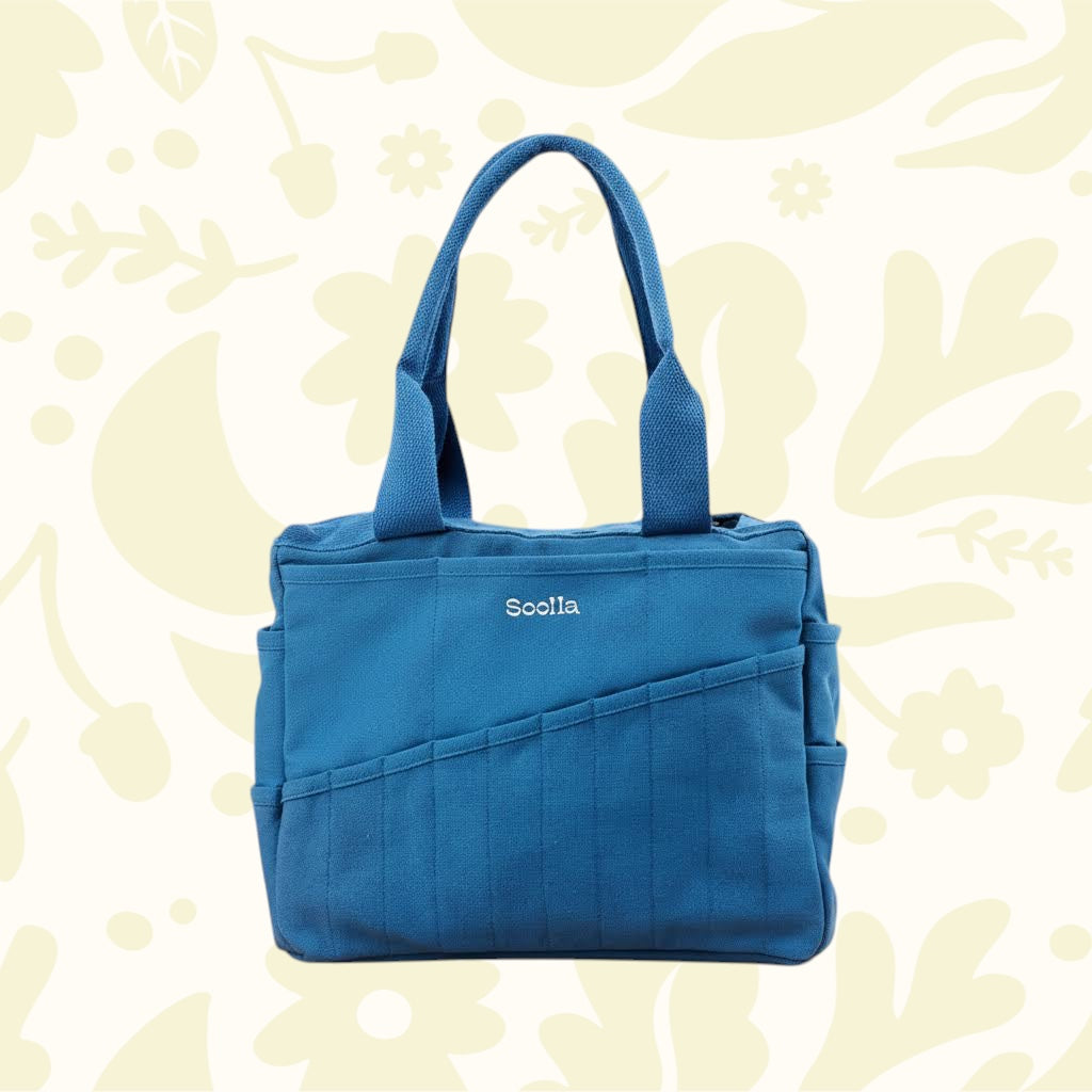 Soolla Studio Pottery Artist Bag Blueberry Bliss with stylish diagonal stitching and handy side pockets for artists’ tools.