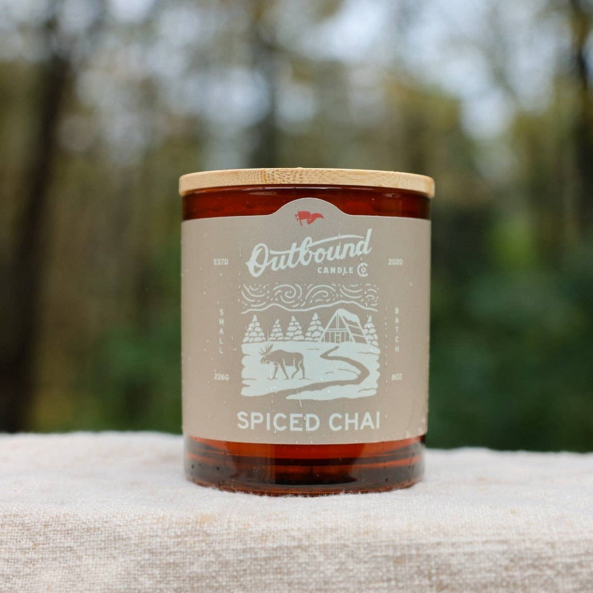 Forager Provisions LTD Outbound Candle Co Spiced Chai soy candle with a bamboo lid in a brown glass jar.