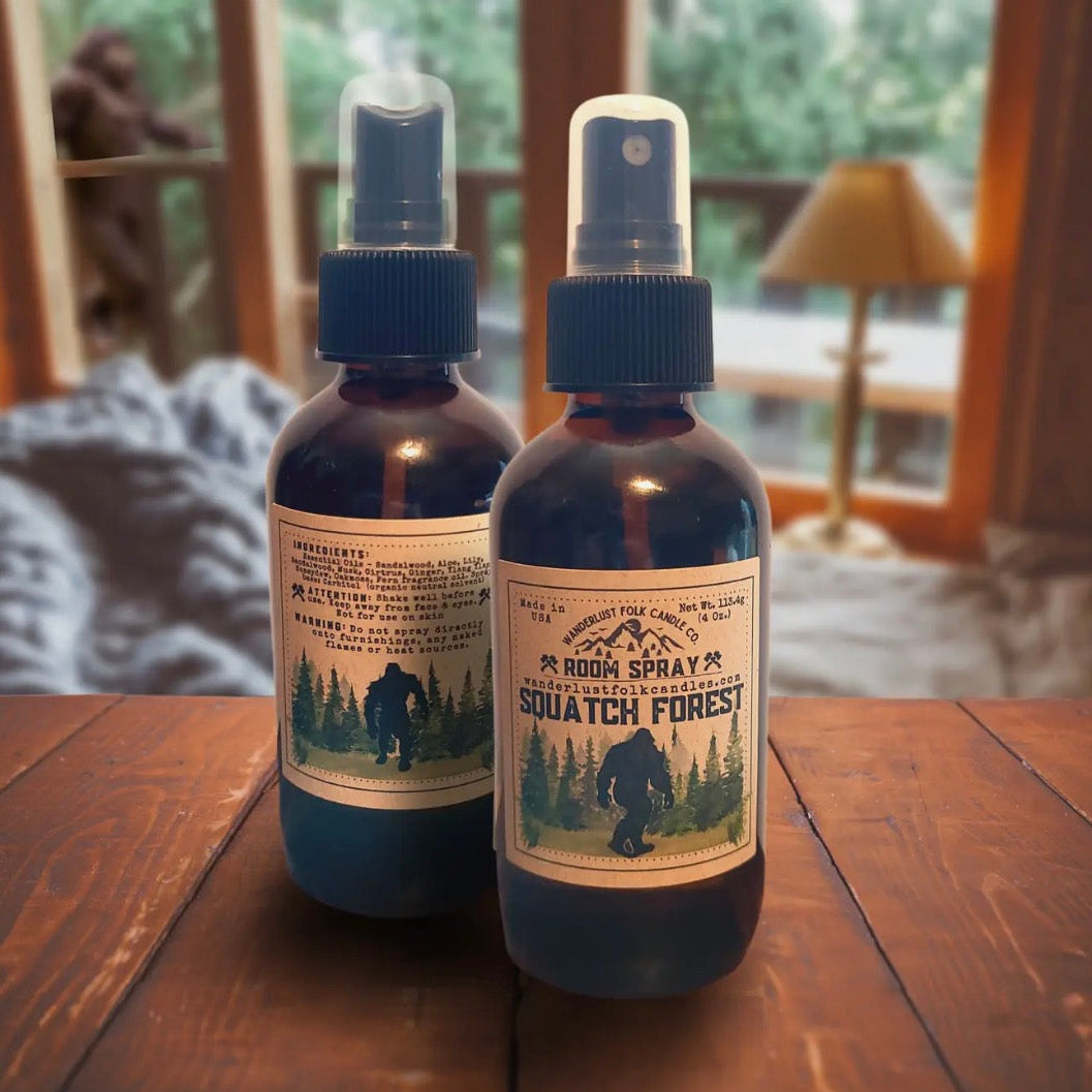Forager Provisions LTD Wanderlust Folk Squatch Forest room spray bottles with Bigfoot label on a wooden table