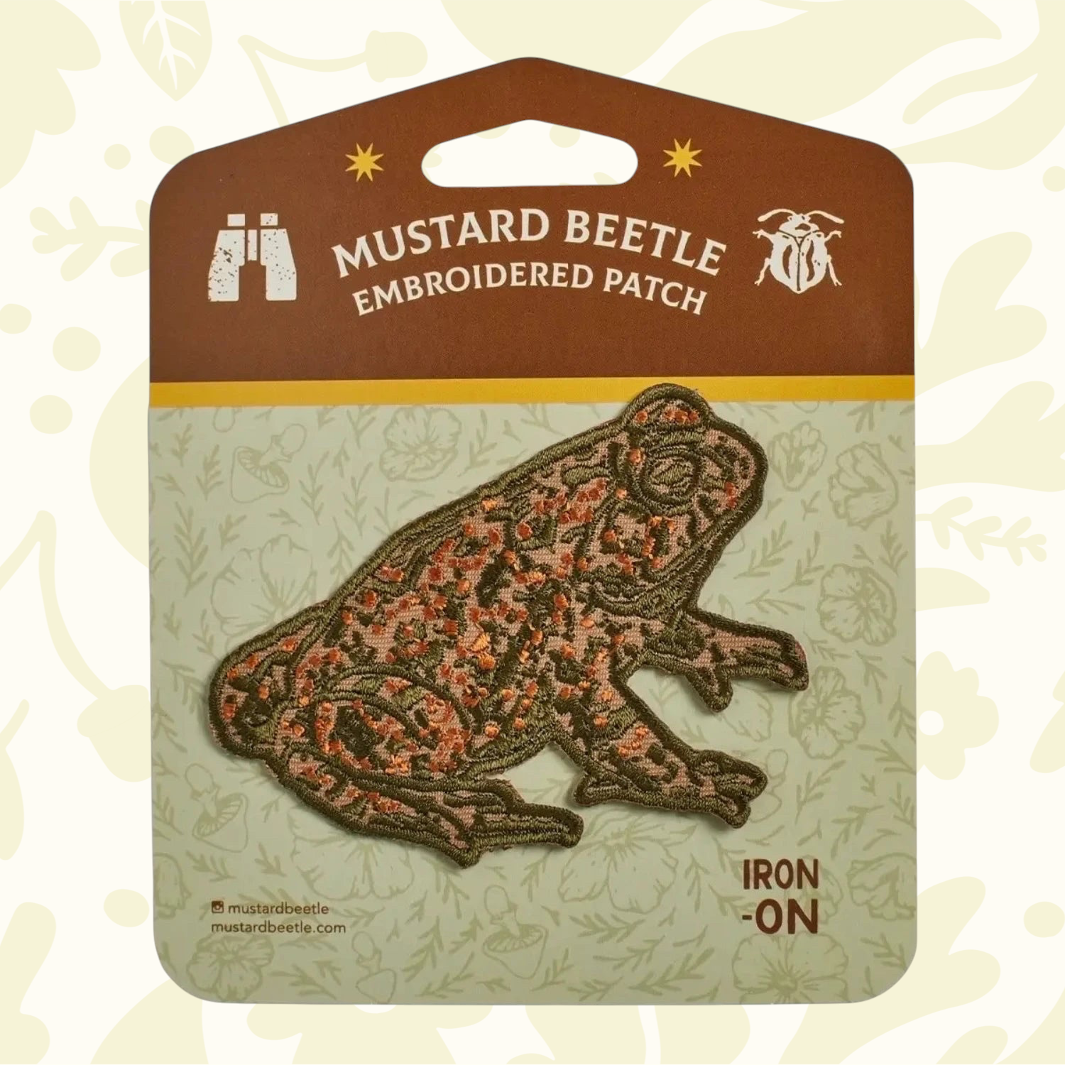 Forager Provisions LTD Mustard Beetle toad iron-on embroidered patch with earthy green and orange details on backing.