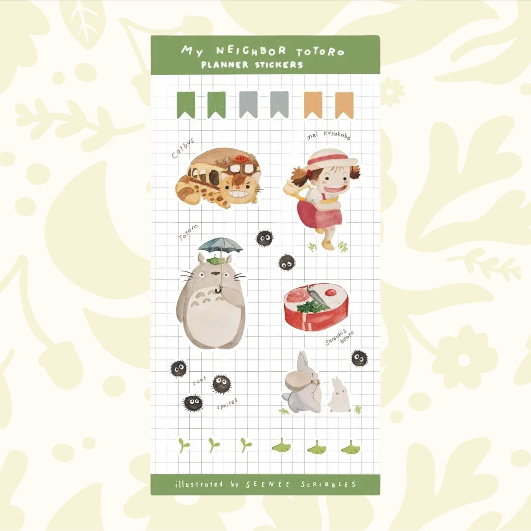 The Seenee Scribbles Studio Ghibli Inspired Sticker Sheet - My Neighbour Totoro is perfect for bullet journaling and scrapbooking, showcasing beloved characters such as Totoro, Catbus, Soot Sprites, and more on a grid background. These stickers bring a touch of magic to your creative projects.