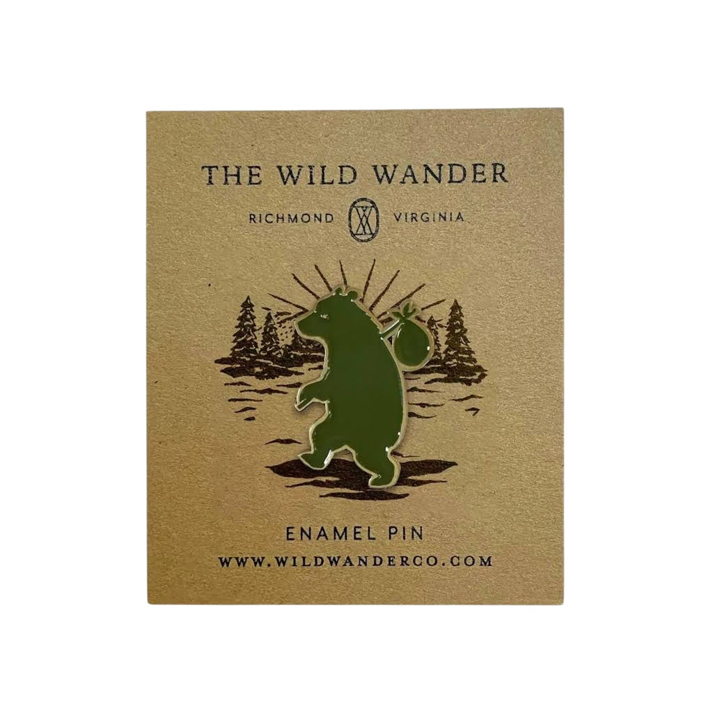 Forager Provisions LTD Wandering Bear enamel pin featuring a green bear with a bindle on a branded backing card.