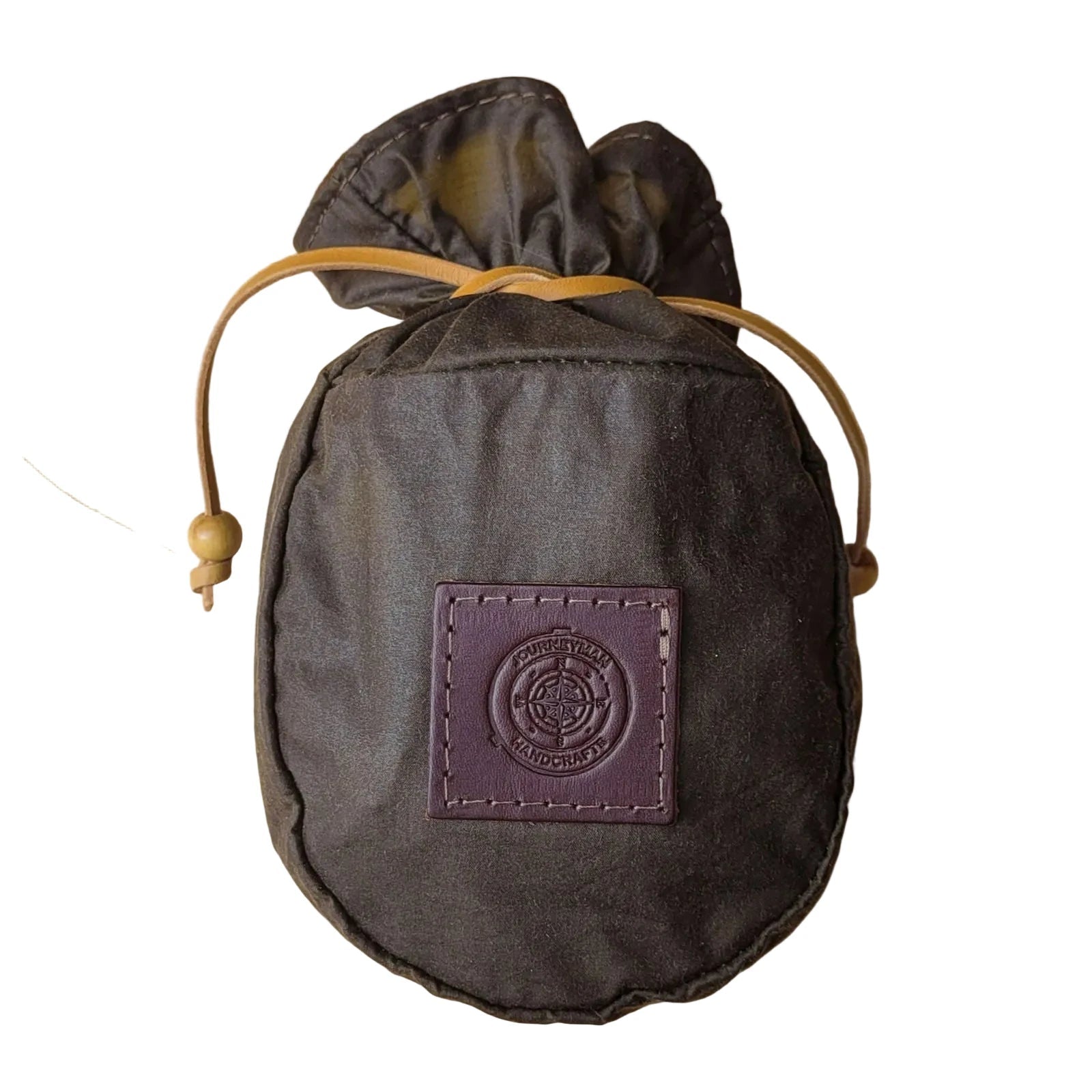 Forager Provisions LTD Journeyman Handcraft coffee brown waxed canvas pouch with a leather drawstring and logo patch.