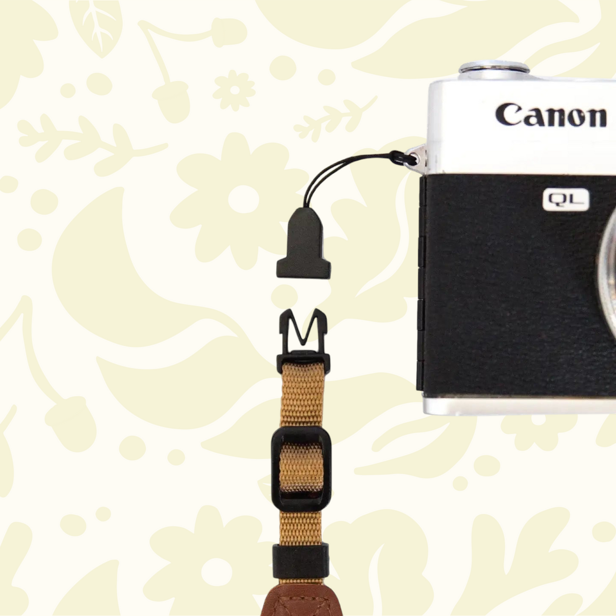Forager Provisions LTD Wildtree camera strap adapters with quick-release buckles attached to a vintage Canon camera.