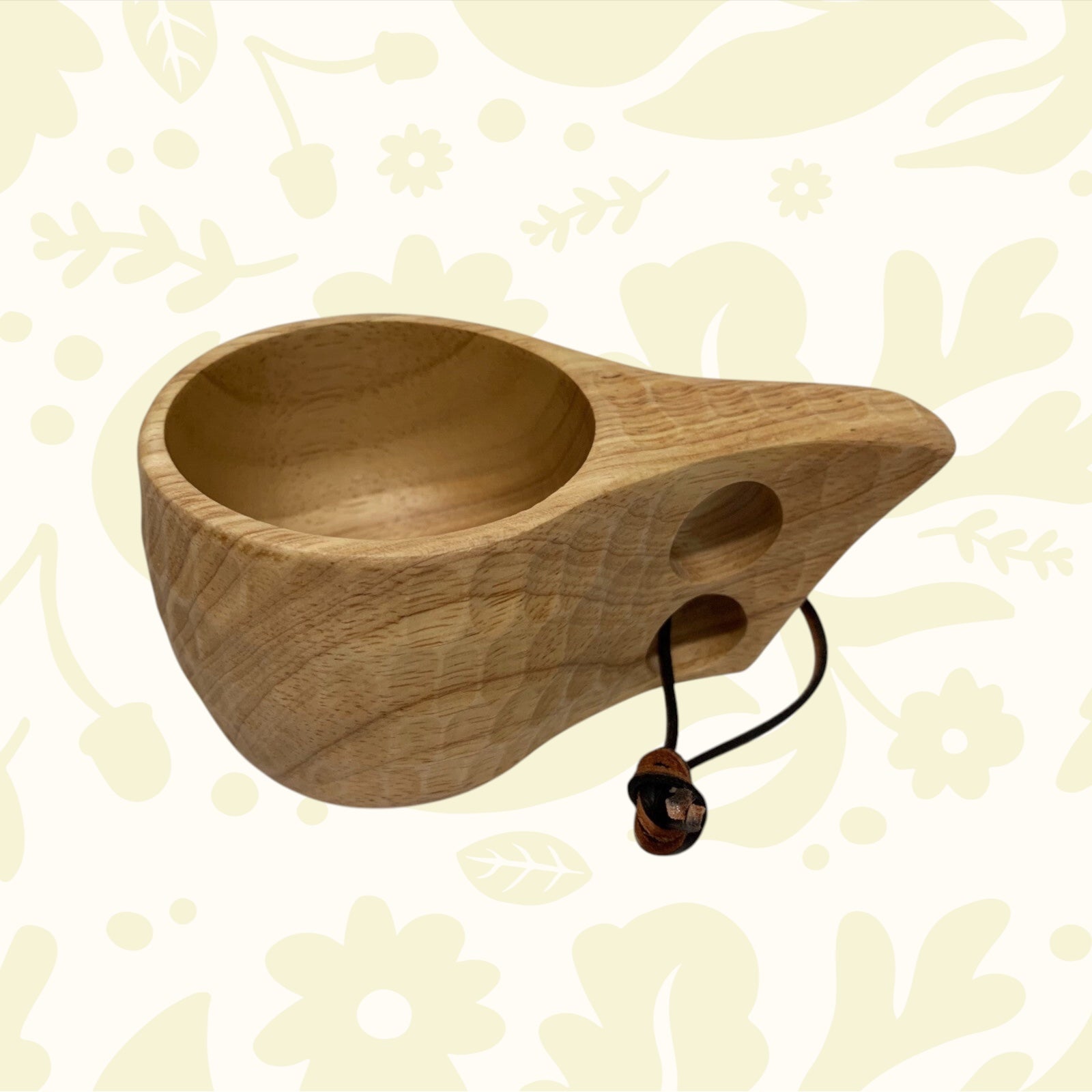 Forager Provisions LTD wooden kuksa camping cup with ergonomic two-finger handle and natural wood grain texture.
