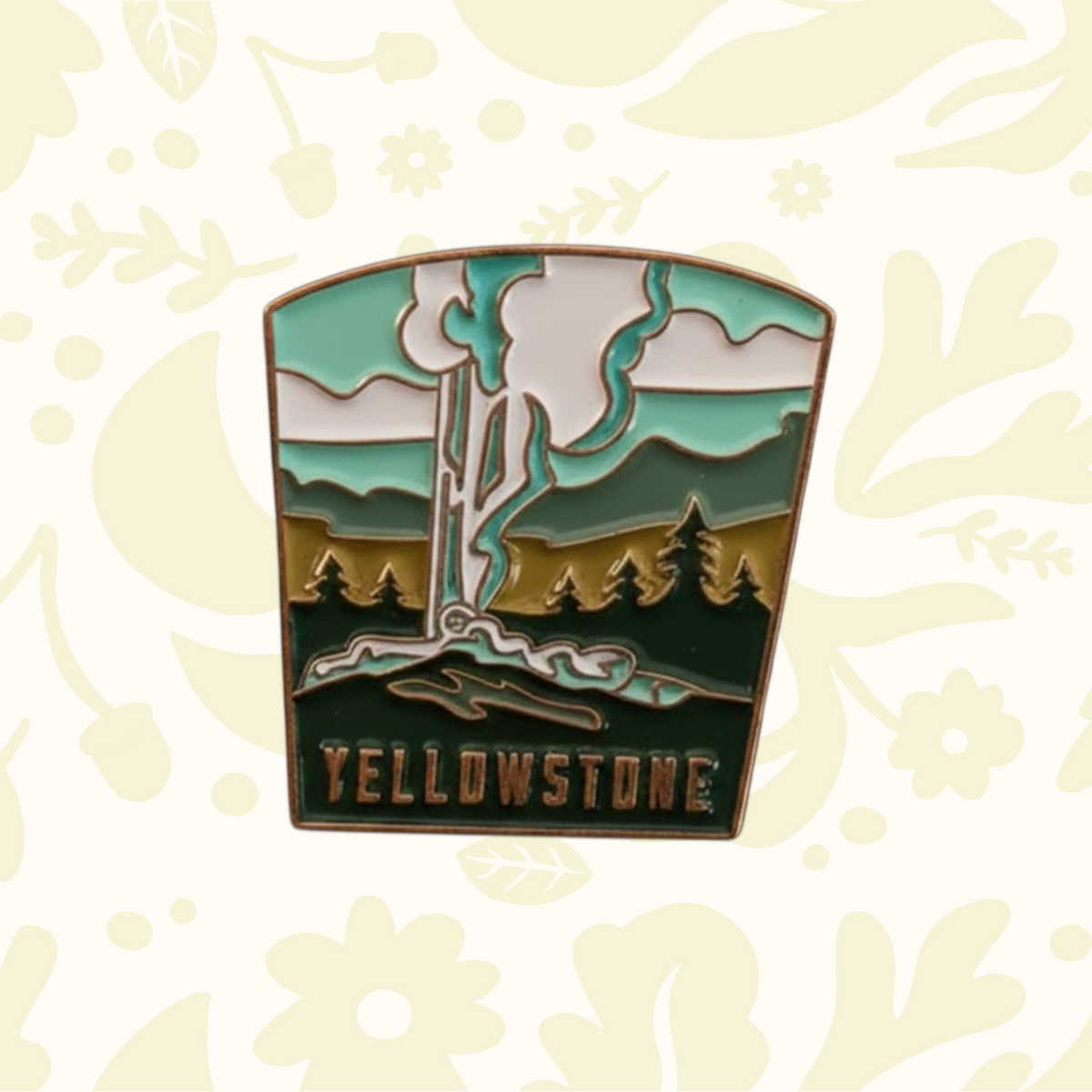 Forager Provisions LTD Yellowstone National Park enamel pin featuring a geyser, pine trees, and mountains.