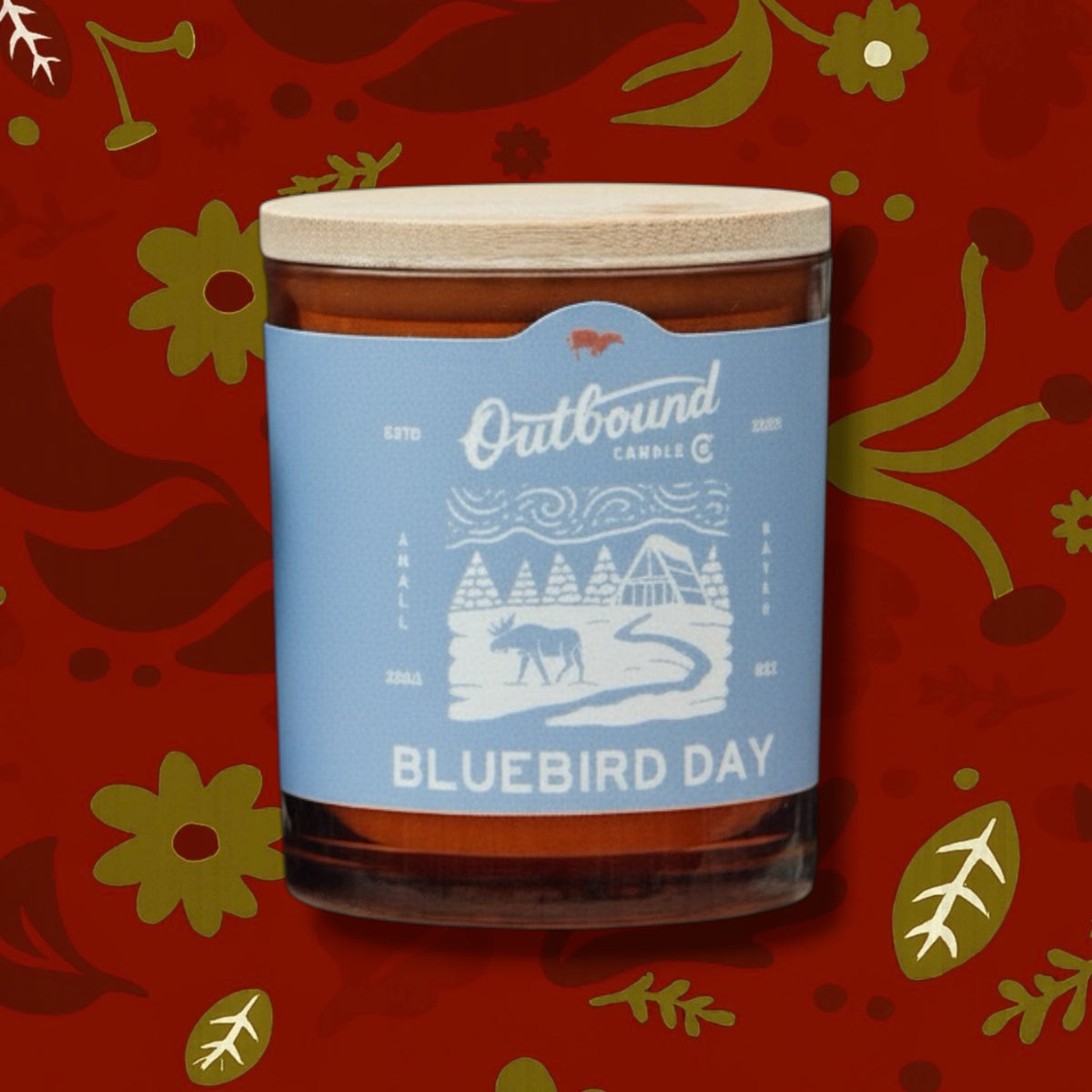 Outbound Candle Co. Bluebird Day soy candle in a glass jar with a bamboo lid, featuring eucalyptus and cypress scent.